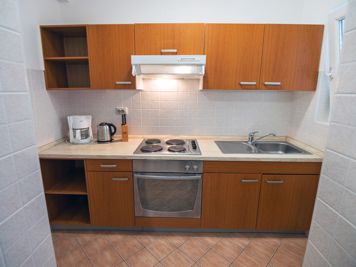 brown apartment, fully equipped kitchen